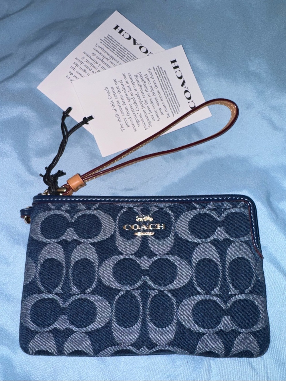 Coach Signature Denim Wristlet in Navy with Brown Leather Strap and cherry charm